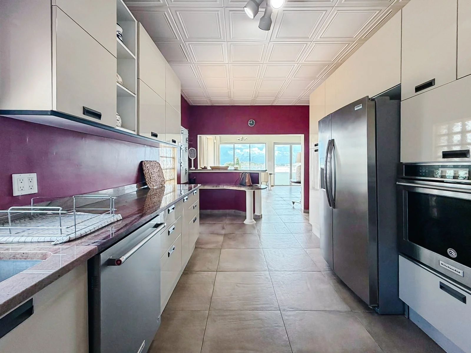 Galley view through the kitchen toward the dining area and bay window